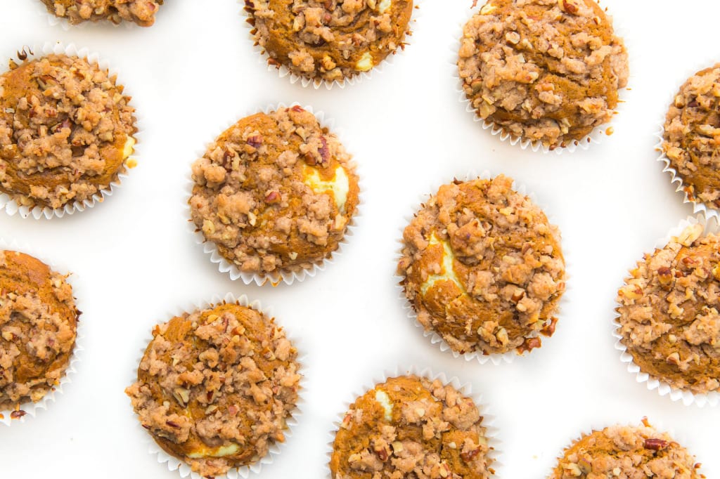 Broma Bakery | The Ultimate Pumpkin Muffins: luscious pumpkin muffins with a cheesecake center and almond streusel topping!