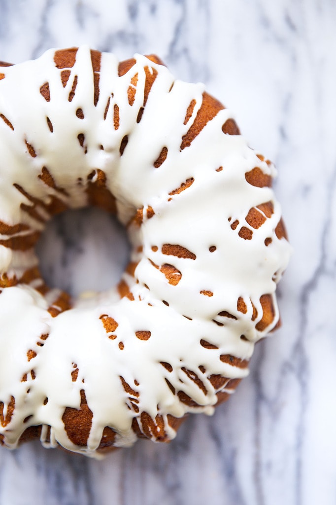 A spiced sweet potato bundt cake with pecan streusel and topped with a maple syrup glaze | via Broma Bakery | #sweetpotato #bundtcake