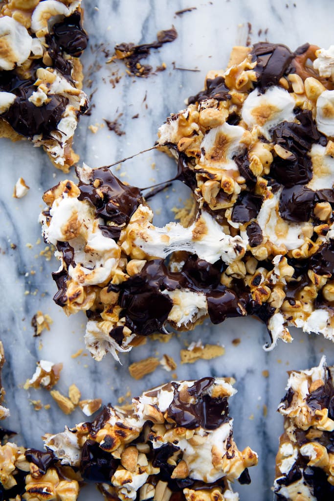 This loaded bark is made with graham crackers, pretzels, peanuts, toffee, popcorn, chocolate, and toasted marshmallows. Betcha can't eat just one!