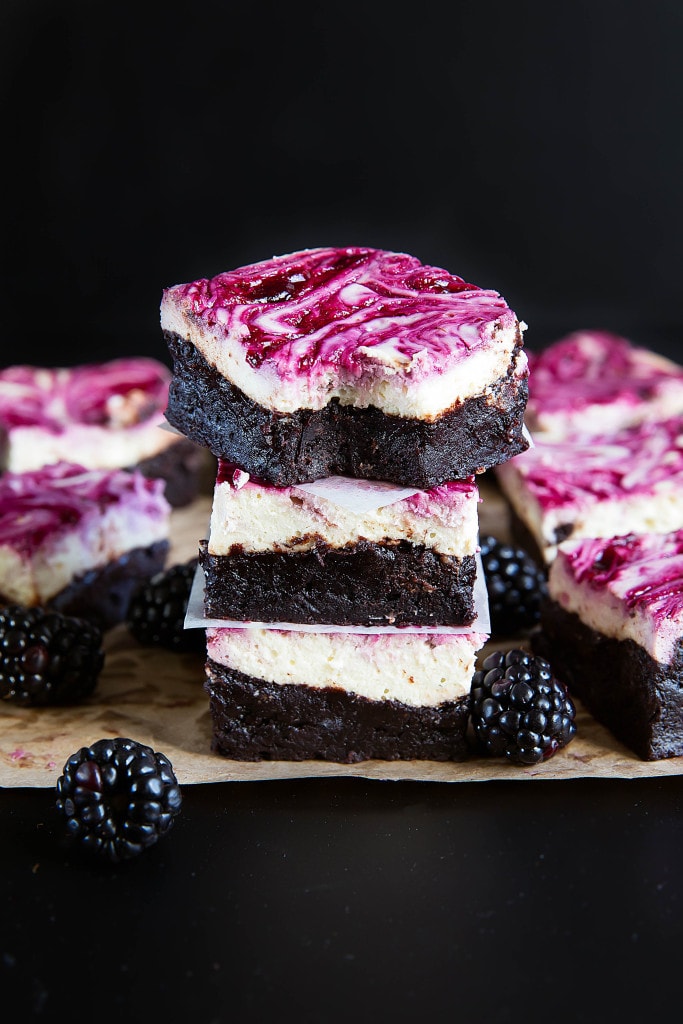 Blackberry cheesecake brownies in a stack