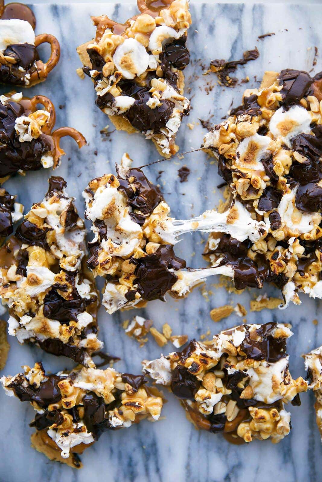 This loaded bark is made with graham crackers, pretzels, peanuts, toffee, popcorn, chocolate, and toasted marshmallows. Betcha can't eat just one!