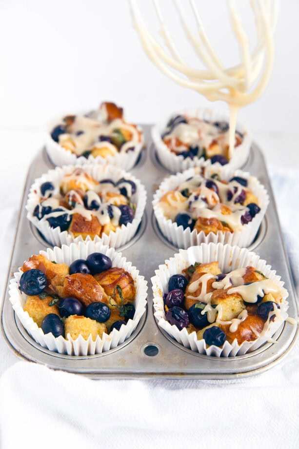 Blueberry Basil French Toast Cups with white maple icing have all the goodness of french toast in a delicious handheld pastry.