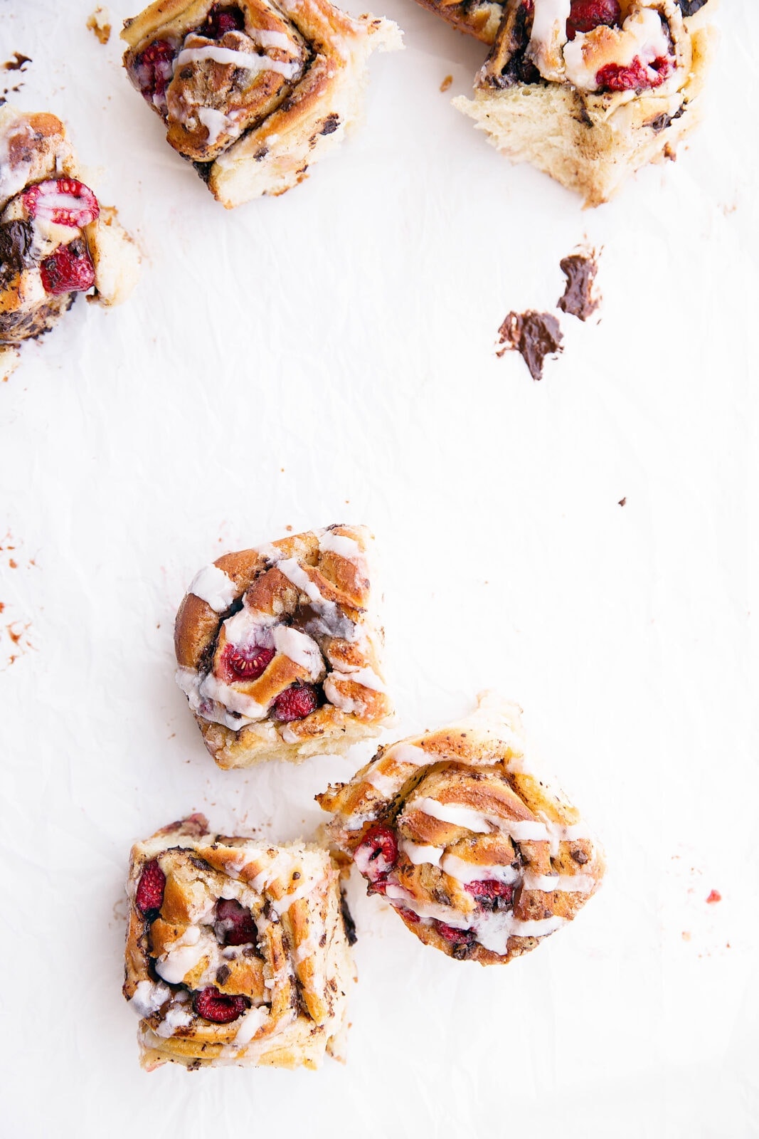 Pieces of dark chocolate and plump raspberries are tucked inside the most light and chewy dough in these Dark Chocolate Raspberry Sticky Buns. Quite possibly the best buns I've ever had!