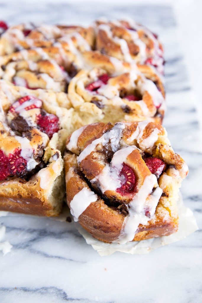 Pieces of dark chocolate and plump raspberries are tucked inside the most light and chewy dough in these Dark Chocolate Raspberry Sticky Buns. Quite possibly the best buns I've ever had!