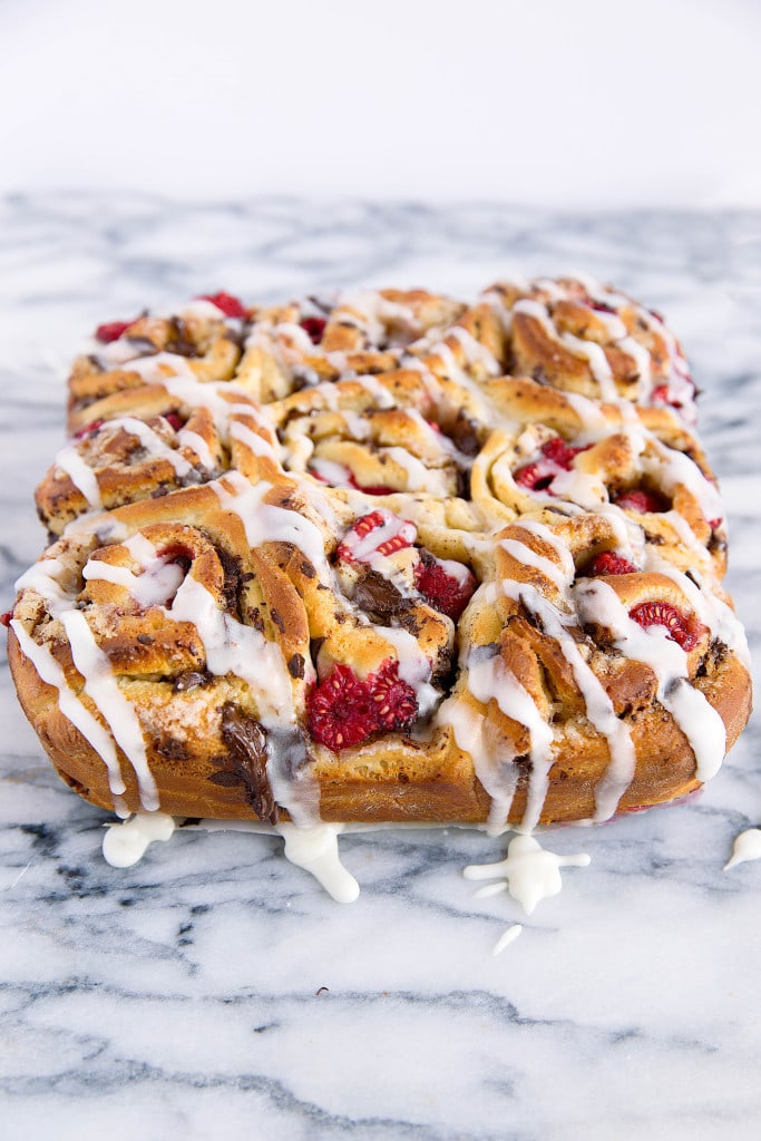 Pieces of dark chocolate and plump raspberries are tucked inside the most light and chewy dough in these Dark Chocolate Raspberry Sticky Buns. Quite possibly the best buns I've ever had!