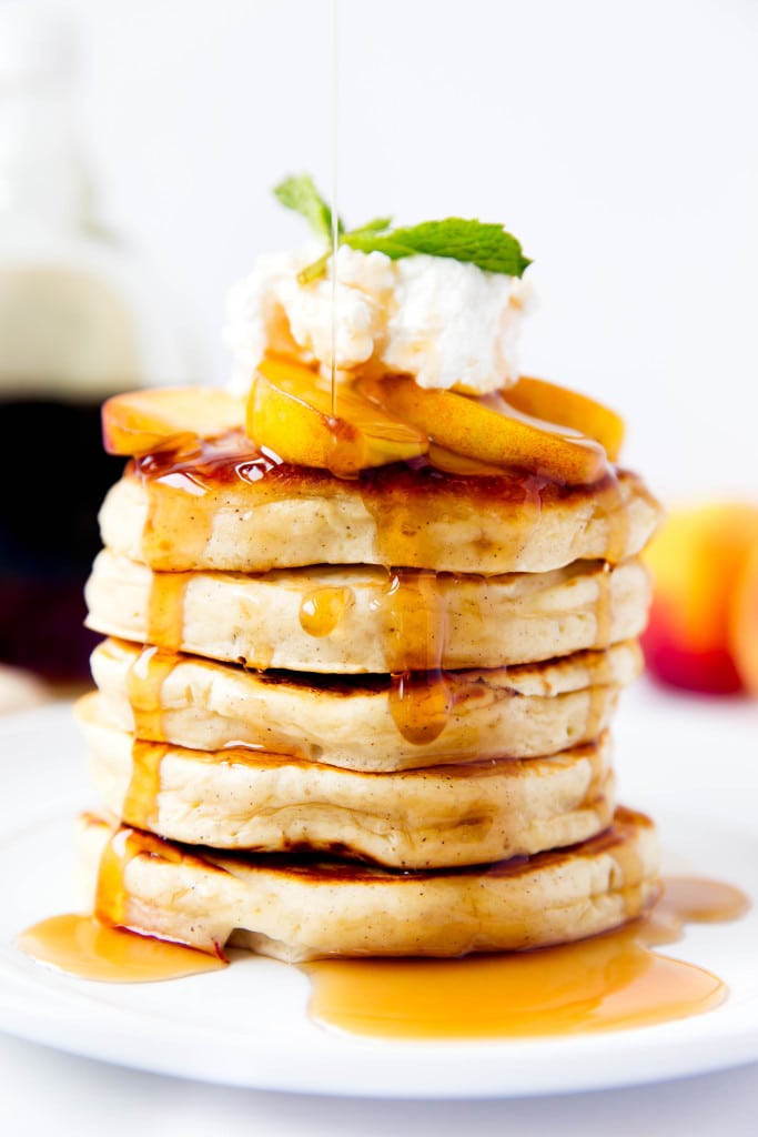 Bourbon Peach Pancakes topped with bourbon-soaked peaches make for the perfect weekend breakfast!