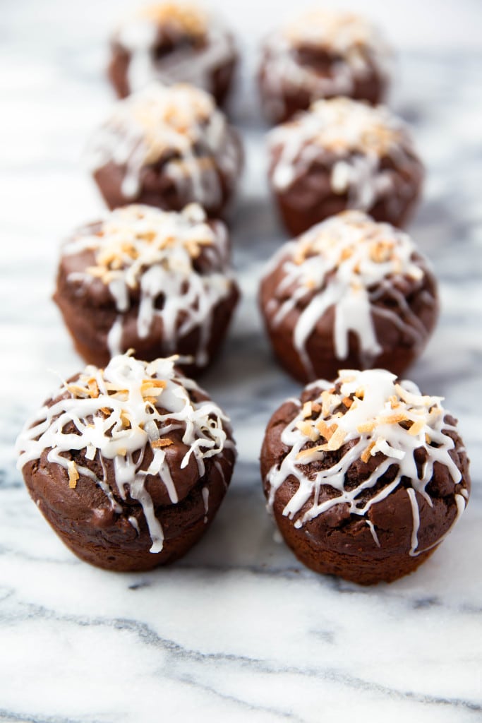 Fluffy Double Chocolate Coconut Muffins made with coconut oil and topped with a coconut drizzle!