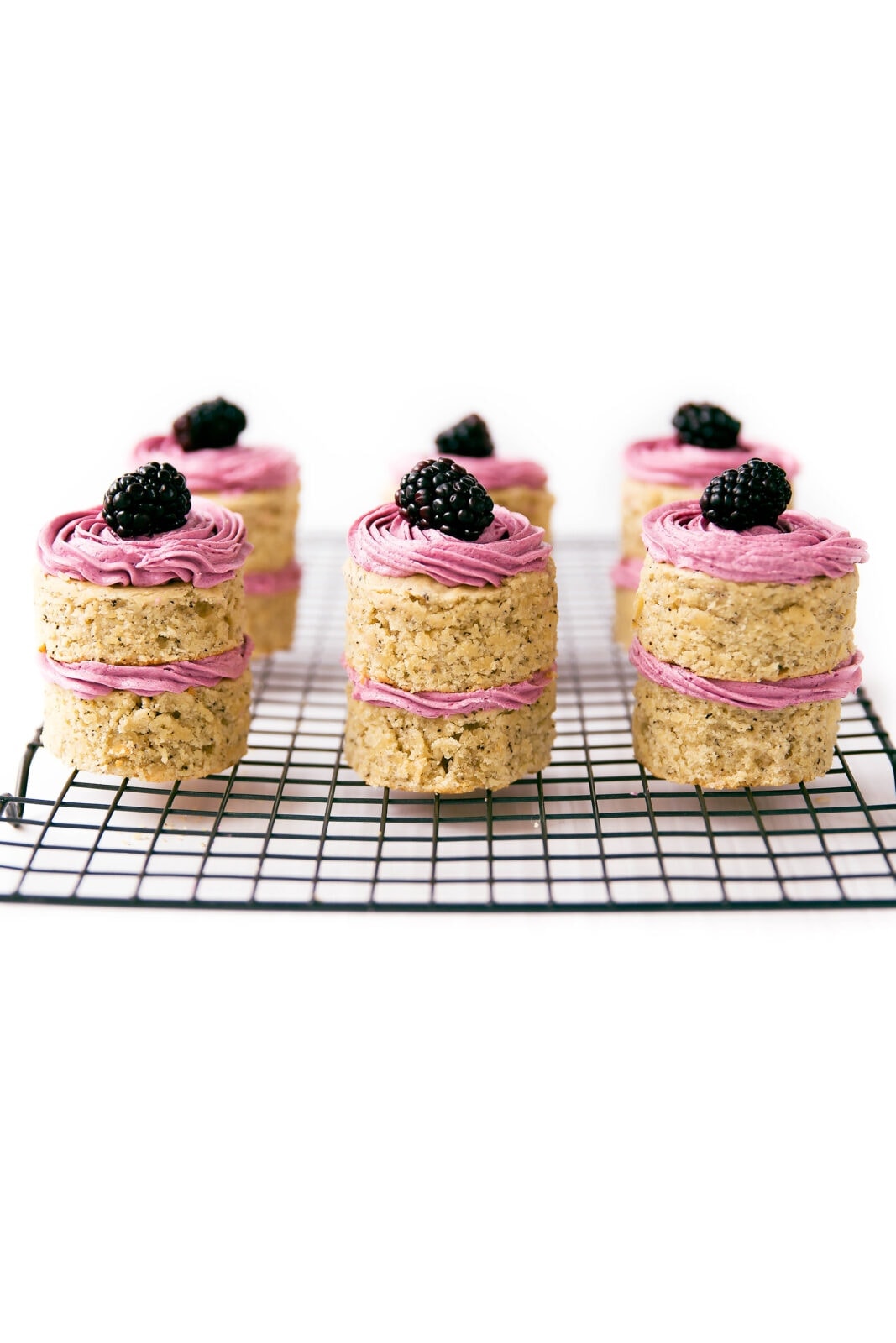 Scrumptious earl grey-infused cakes topped with a roasted blackberry buttercream