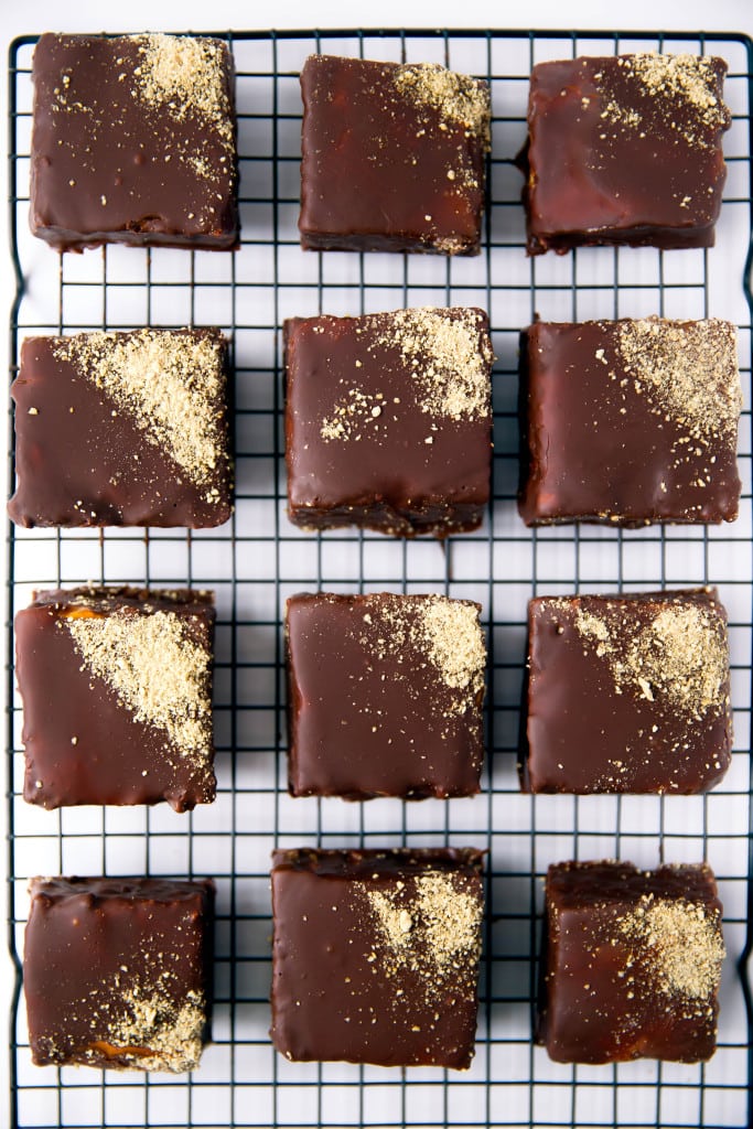 We're taking campfire treats to the next level with these S'mores Marshmallows: silky homemade marshmallows topped with salted caramel and covered in dark chocolate & graham cracker crumbs. Yes, please!