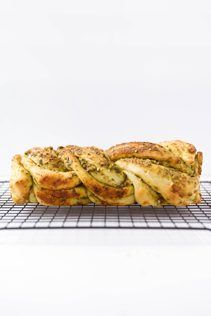 loaf of Parmesan Pesto Bread on a wire rack