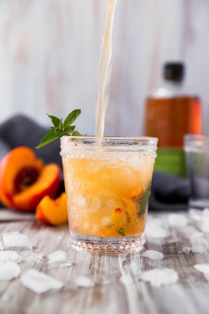 The classic mint julep gets a twist with this mouth-watering Peach Julep!