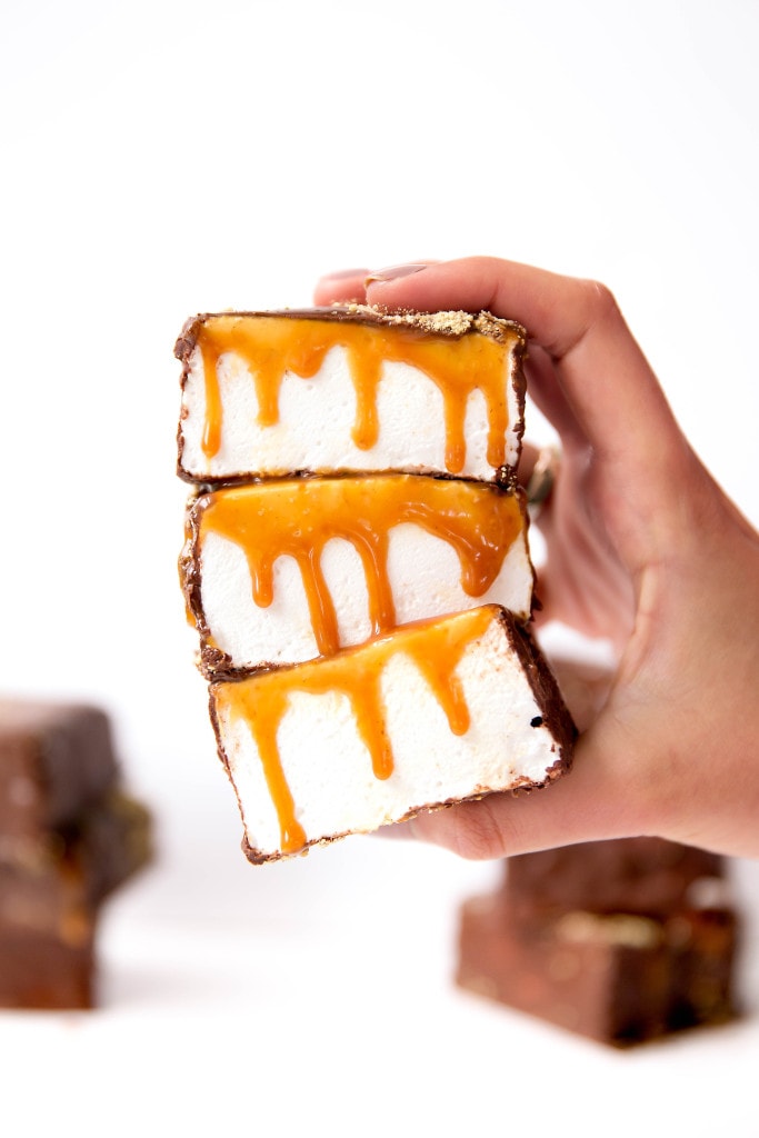 We're taking campfire treats to the next level with these S'mores Marshmallows: silky homemade marshmallows topped with salted caramel and covered in dark chocolate & graham cracker crumbs. Yes, please!