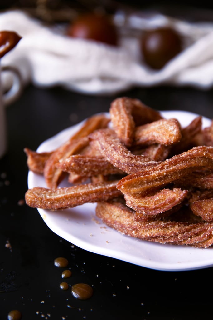 Just in time for fall: light and airy apple cider churros with salted caramel sauce perfect for dunking! 