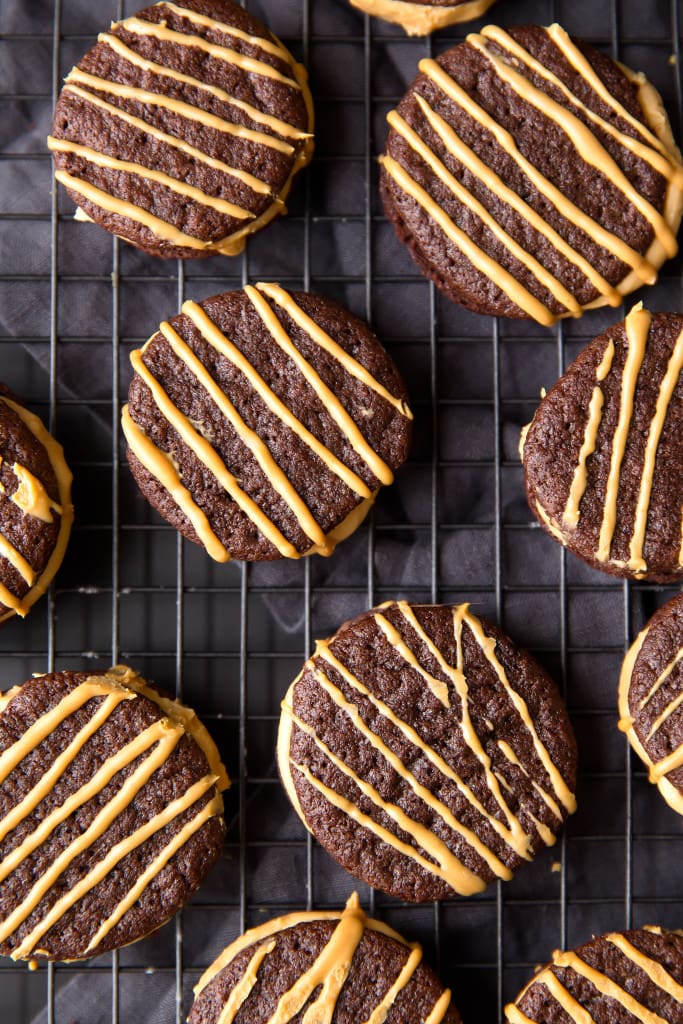 Dark Chocolate Peanut Butter Sandwich Cookies: a fluffy peanut butter frosting sandwiched between two brownie-like cookies.