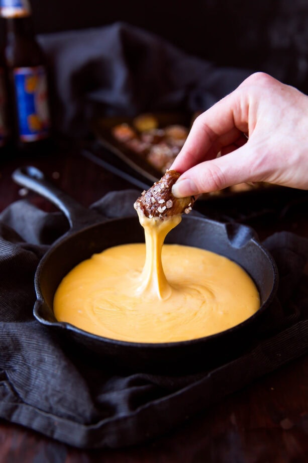 Bring on game day with these homemade pretzel bites topped with everything bagel seasoning, served with beer and cheddar cheese dip!