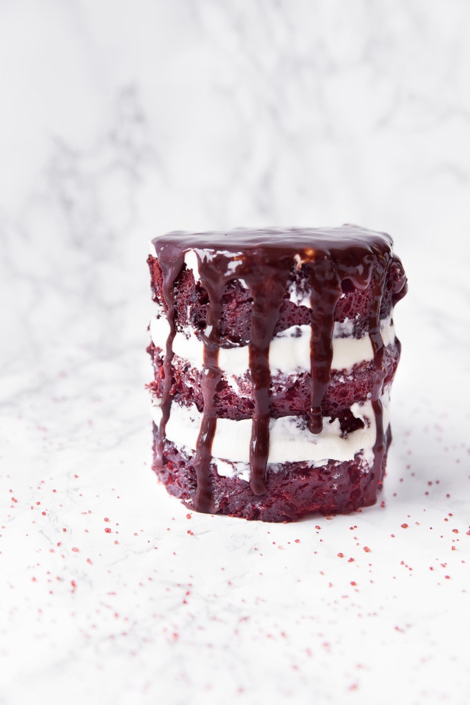 red velvet mug cake topped with melted chocolate