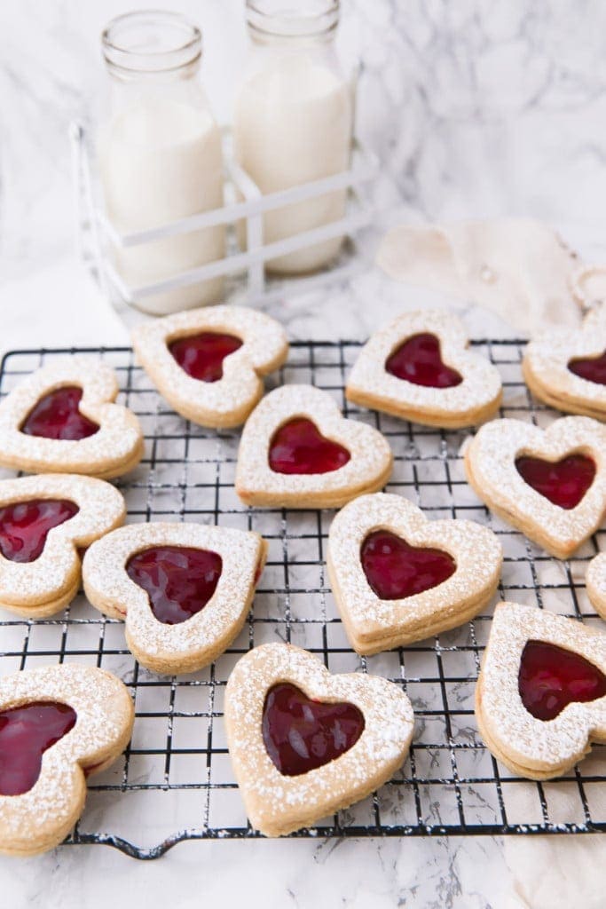cherry linzer cookies on a wire rack