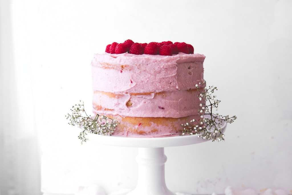 A fluffy banana cake layered with bright raspberry frosting makes for a show stopping springtime dessert.