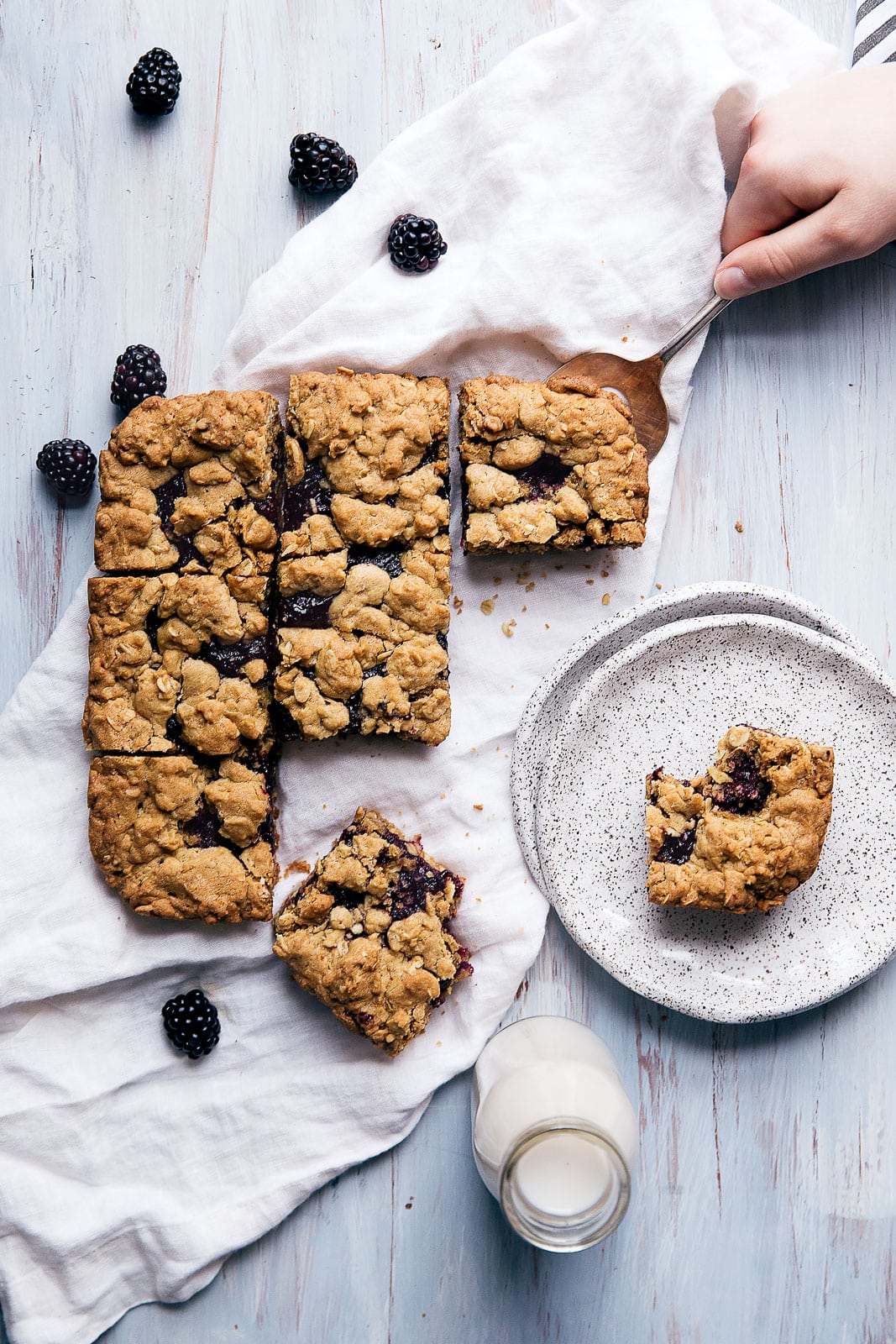 Chewy oatmeal bars with a homemade blackberry jam center and crumble topping
