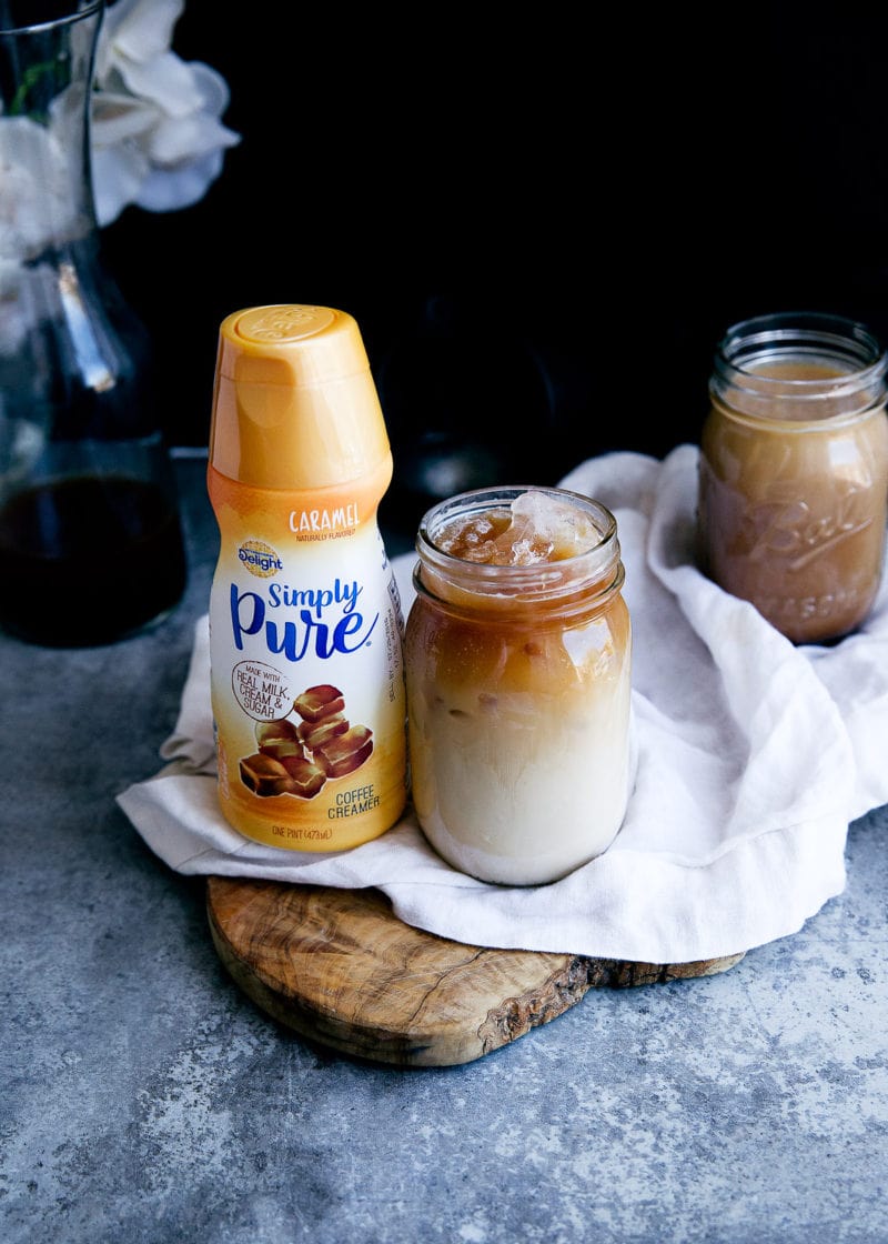 homemade cold brew coffee next to a container of creamer