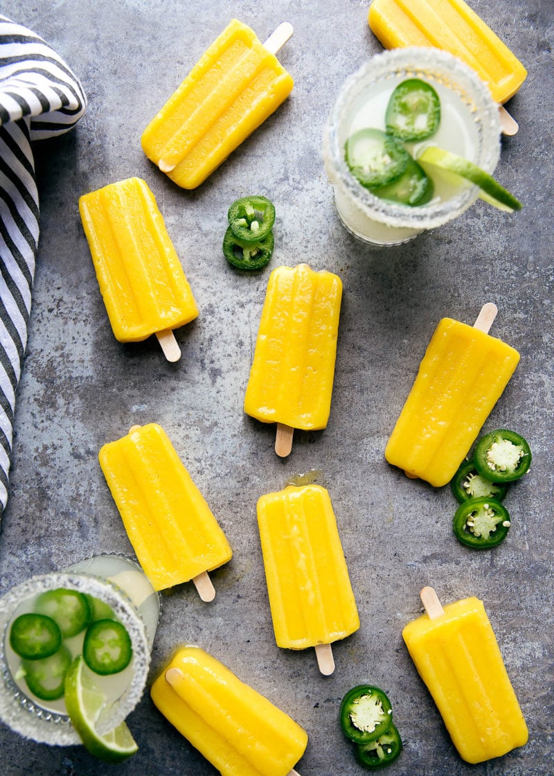 Forget ice cubes, we're dipping Jalapeño Mango Margarita Popsicles into our drinks! Perfect for Cinco de Mayo!