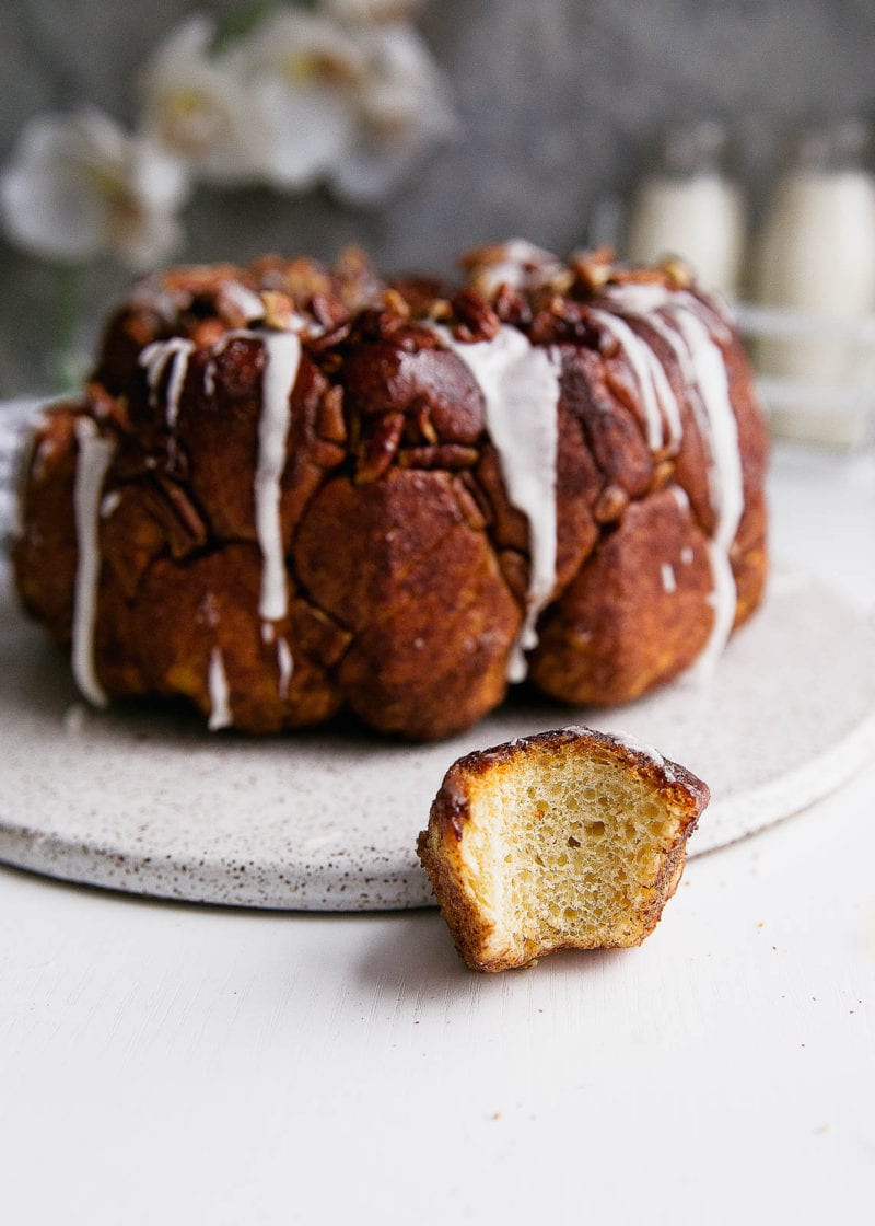 A soft and pillowy buttered rum monkey bread covered in cinnamon sugar, pecans, and topped with rum icing. So, like, can I have this every weekend?
