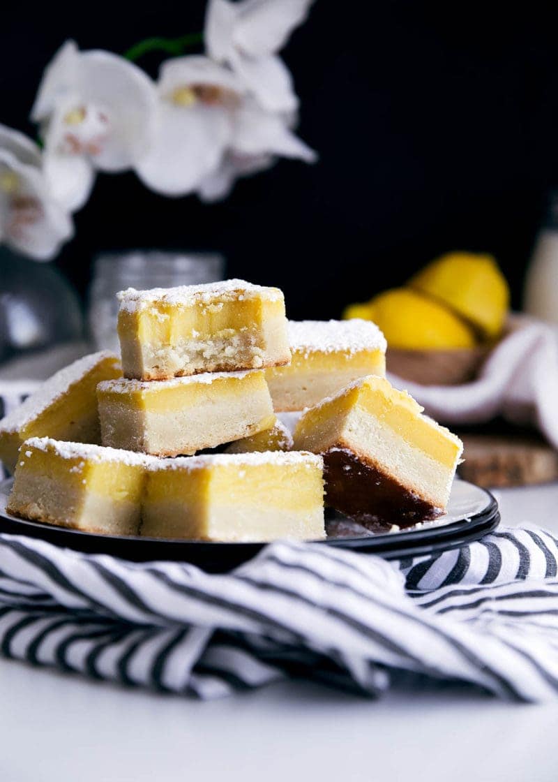 stack of ginger lemon bars on a plate