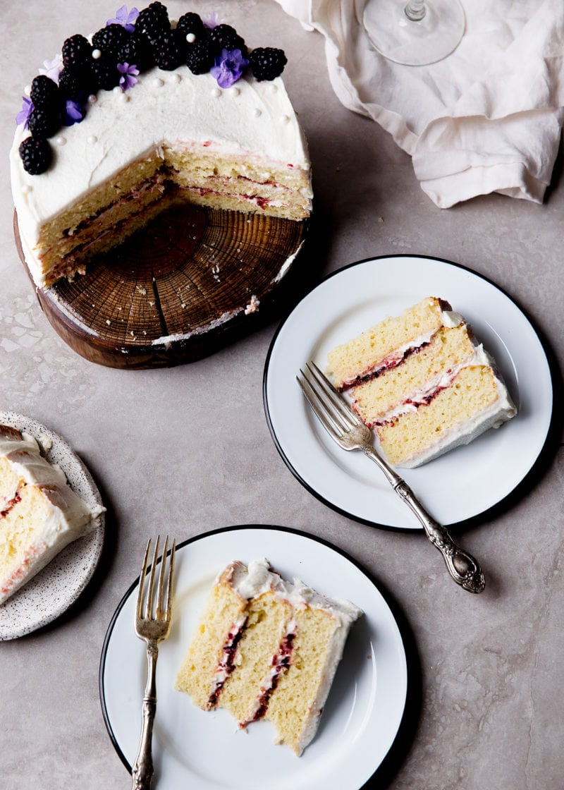 A soft vanilla cake layered with raspberry jam and vanilla CHAMPAGNE FROSTING. Let's get this party started.