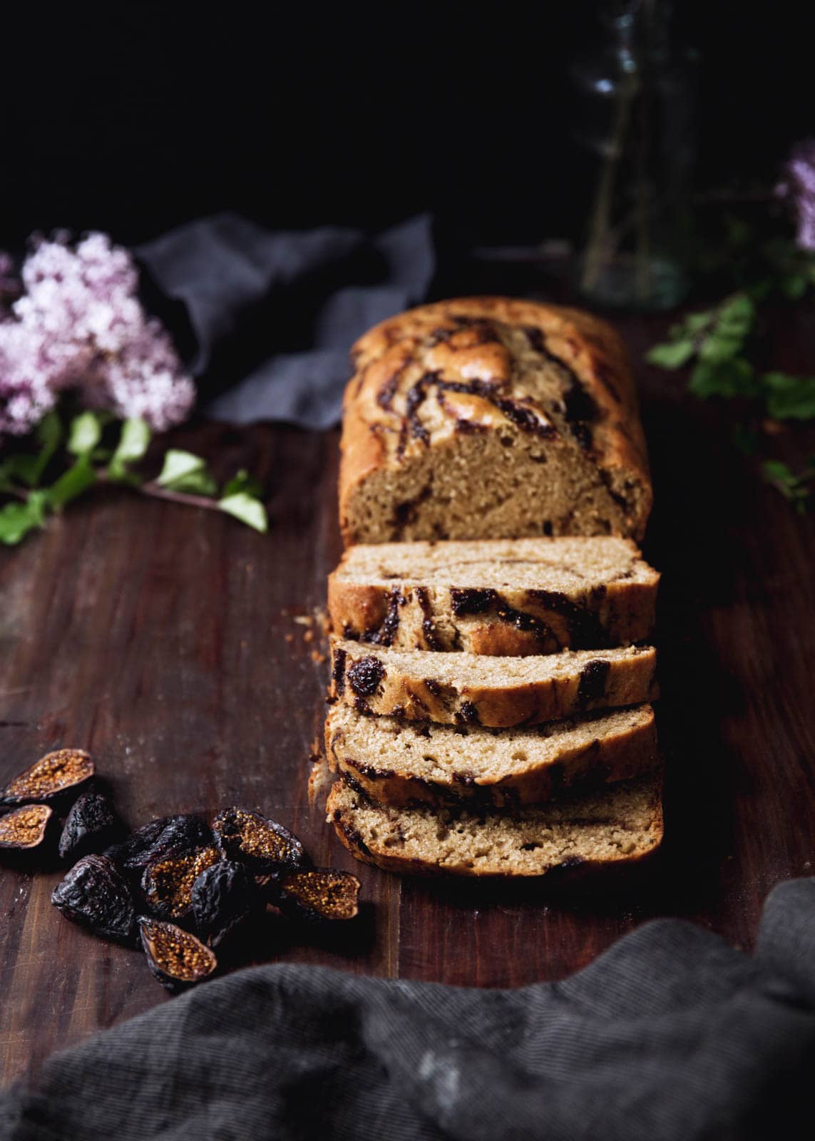 bourbon fig banana bread on a wood board
