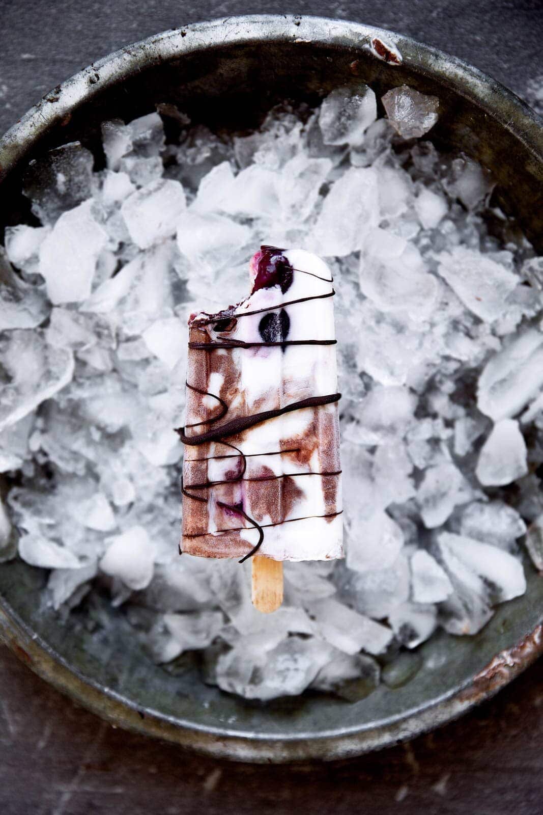 A mouth-watering combo of chocolate, fresh cherries, and vanilla will make these Black Forest Popsicles a smash hit at your next get together!