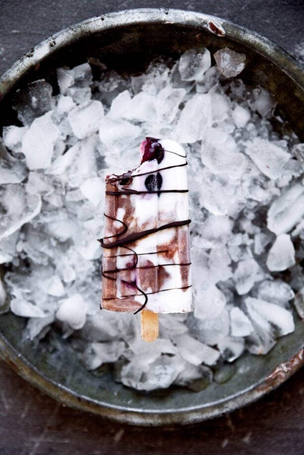 A mouth-watering combo of chocolate, fresh cherries, and vanilla will make these Black Forest Popsicles a smash hit at your next get together!