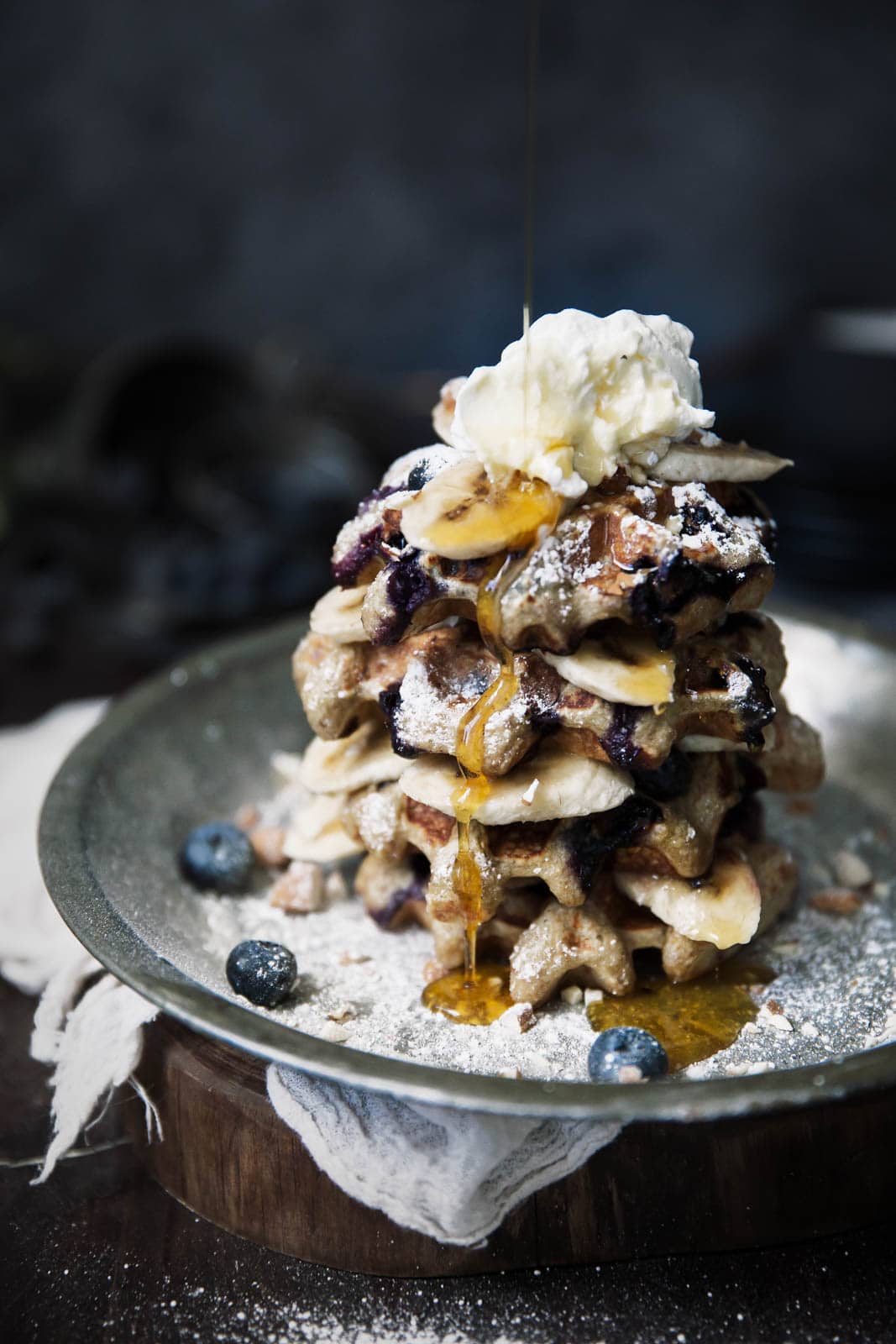 gluten free waffles with whipped cream and maple syrup