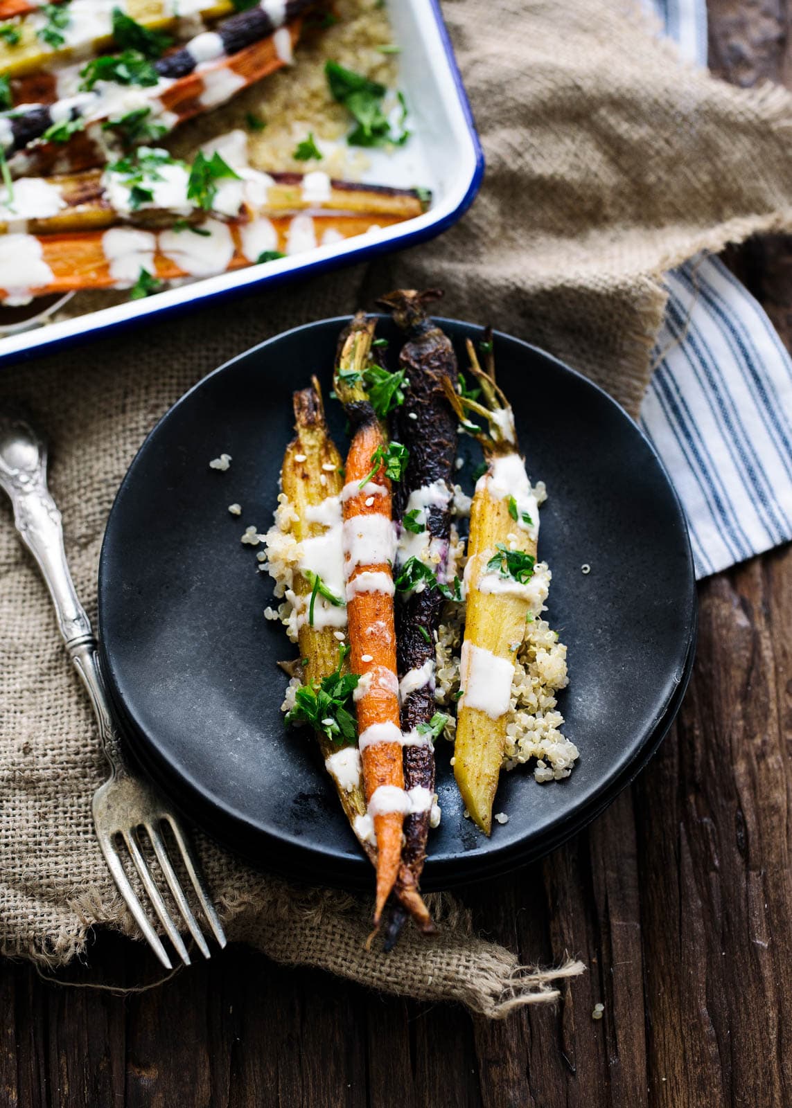 Cumin Roasted Carrots with Tahini Dressing on a plate