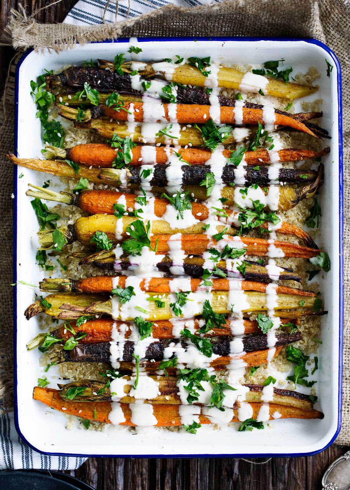 Cumin Roasted Carrots with Tahini Dressing in baking dish