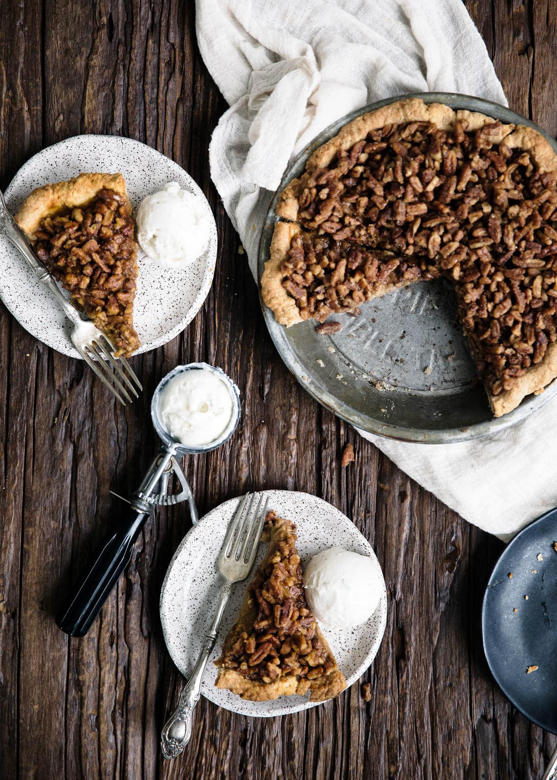 Maple Pecan Bourbon Pumpkin Pie in a pie plate 