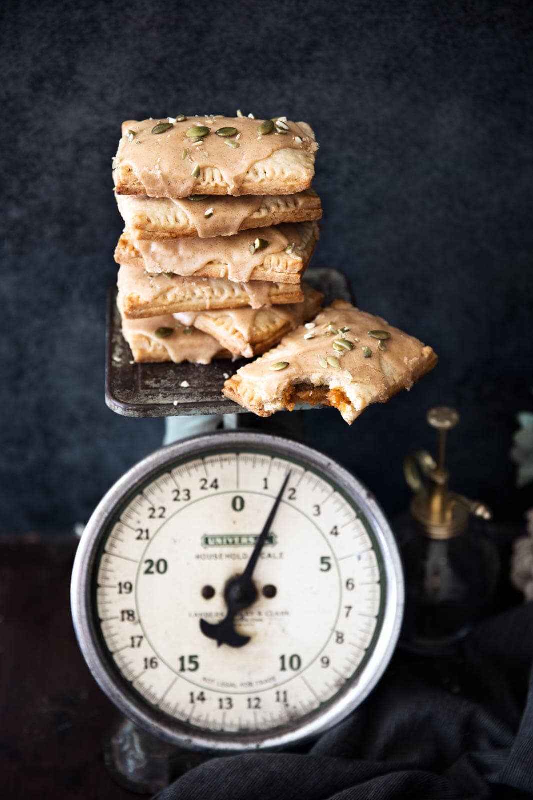 Fresh and flakey homemade Pumpkin Butter Pop Tarts with a cinnamon icing and pepitas. Woah.