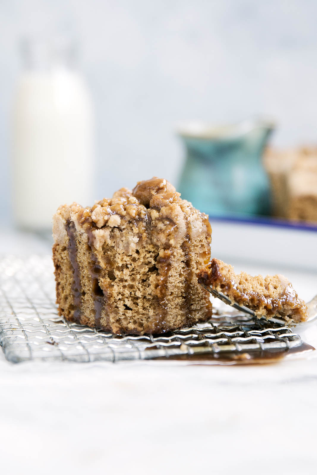 Perfectly spiced and super moist, this Icelandic skyr spice cake is topped with a ridiculously addicting crumb topping and toffee sauce!