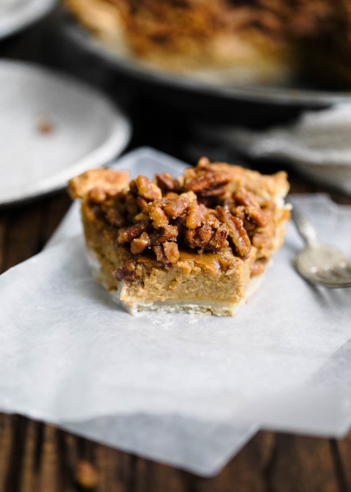 Maple Pecan Bourbon Pumpkin Pie slice on paper towel