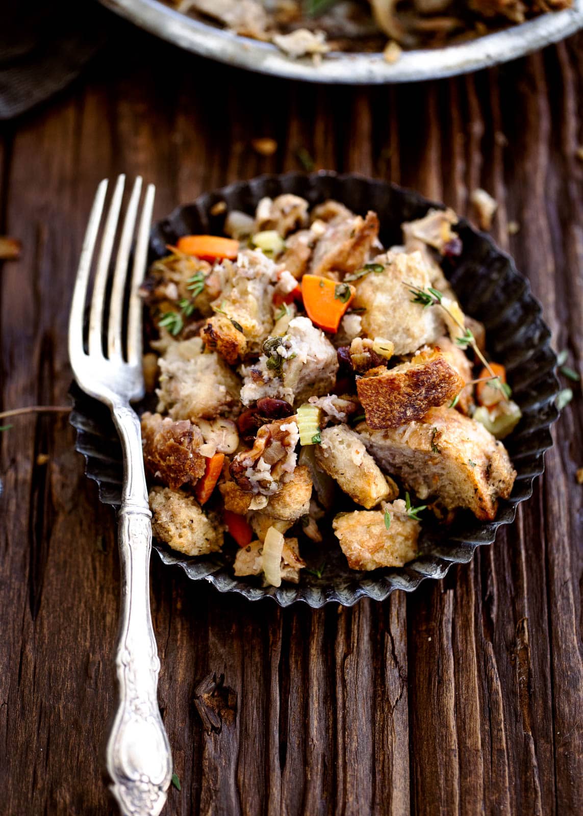 The best part of Thanksgiving is stuffing. So why not make the ultimate Thanksgiving stuffing with sourdough, dark meat chicken, dried cherries, walnuts, and loads of herbs?