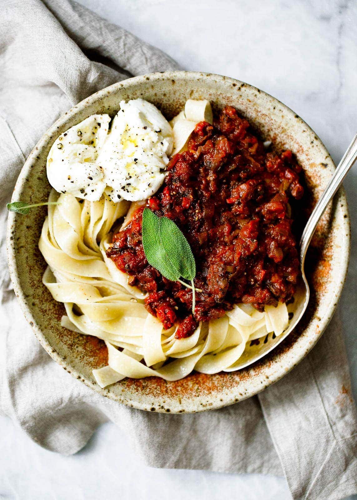 mushroom bolognese sauce over pasta