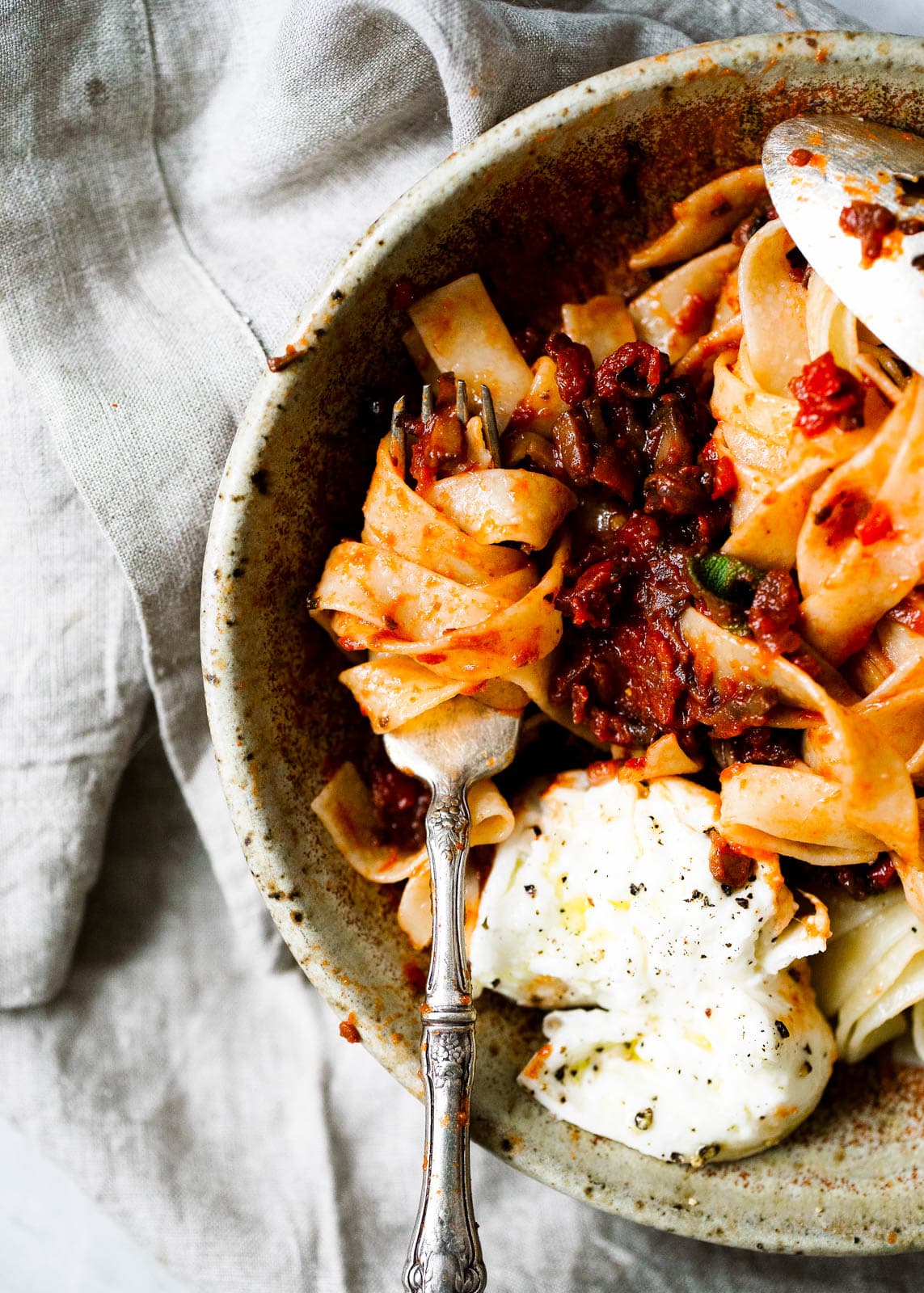 mushroom bolognese sauce on pasta with cheese