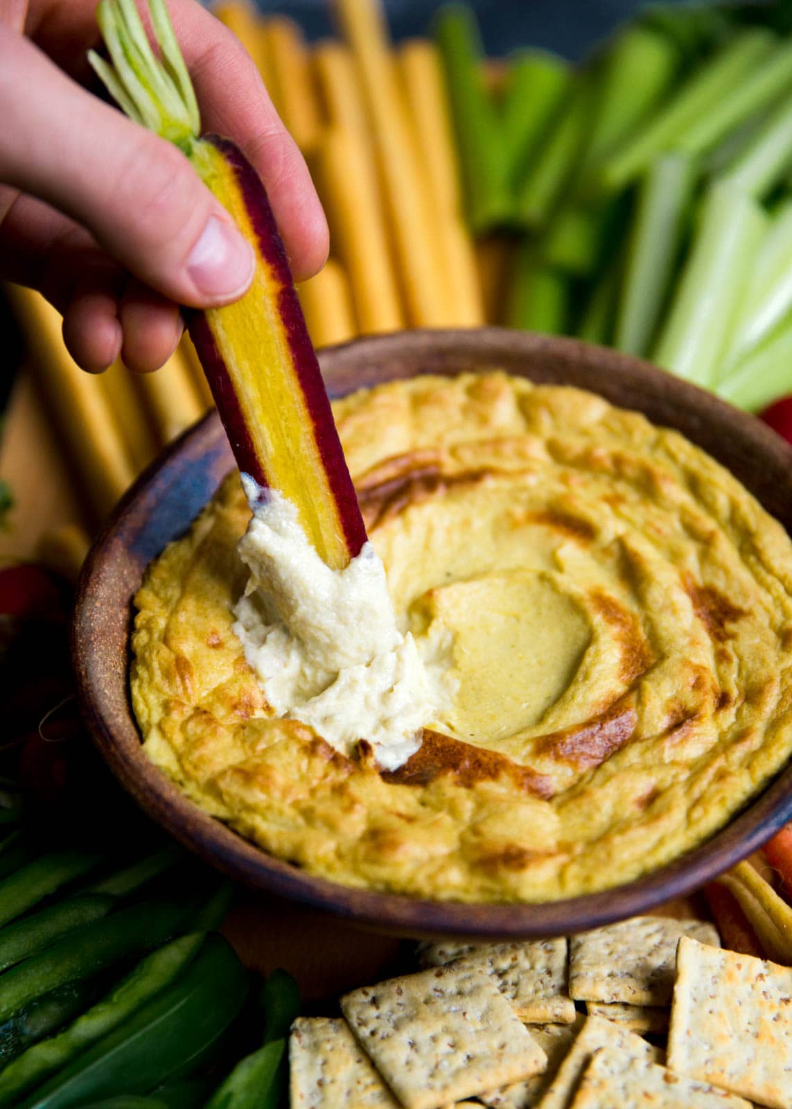 Mom's creamy, cheesy Artichoke Dip with a bountiful crudités is perfect for a crowd.