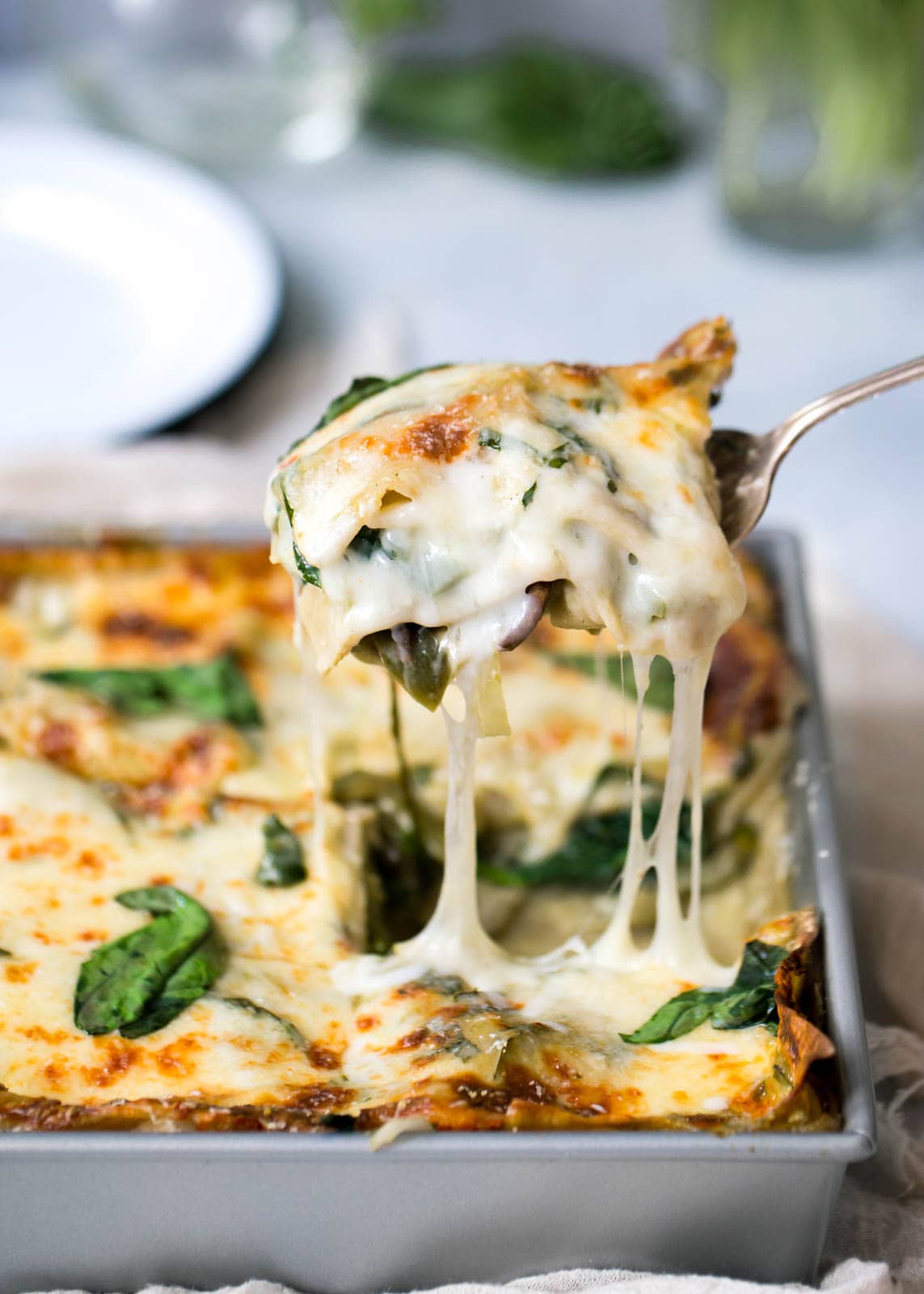 serving a slice of Vegetarian Green Lasagna 
