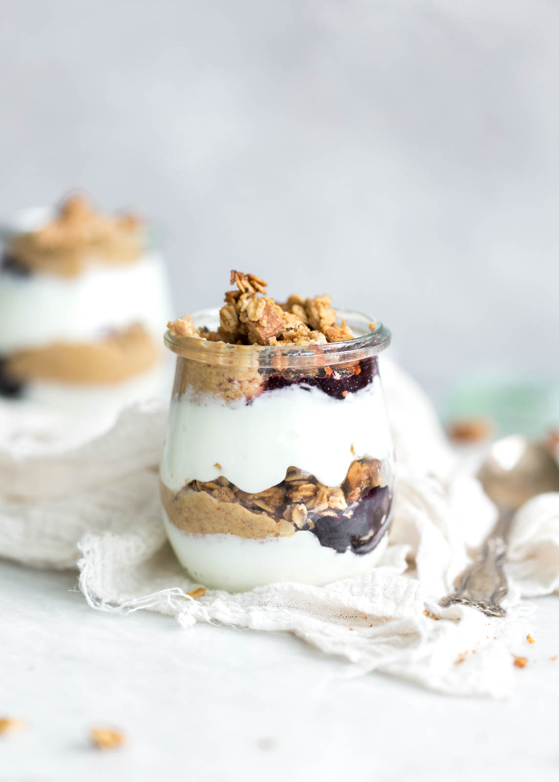 Peanut Butter and Jelly Yogurt Parfaits made with homemade peanut butter and honey granola and protein-packed Greek yogurt. YUM!