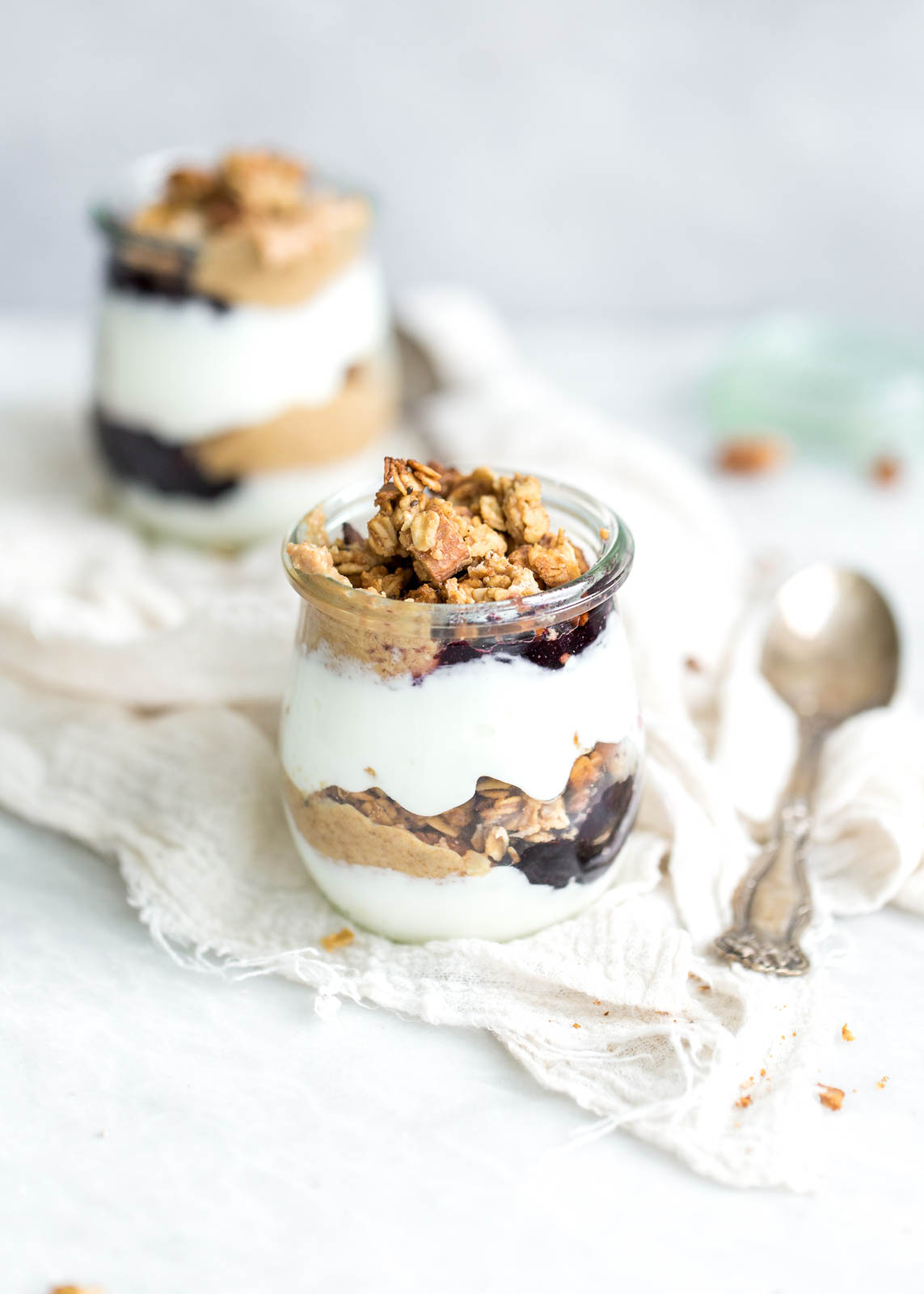 Peanut Butter and Jelly Yogurt Parfaits made with homemade peanut butter and honey granola and protein-packed Greek yogurt. YUM!