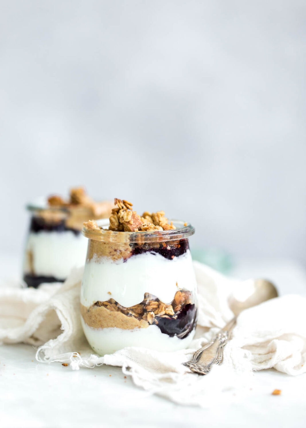 Peanut Butter and Jelly Yogurt Parfaits made with homemade peanut butter and honey granola and protein-packed Greek yogurt. YUM!