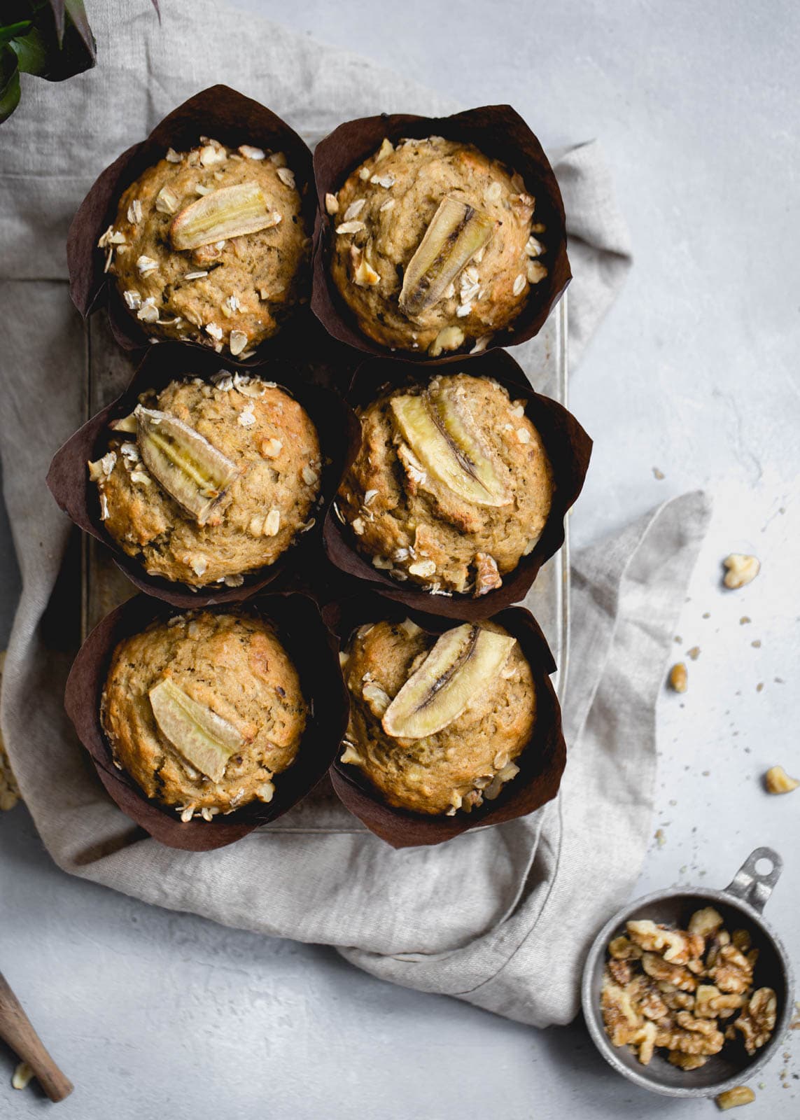whole wheat banana muffins next to walnuts