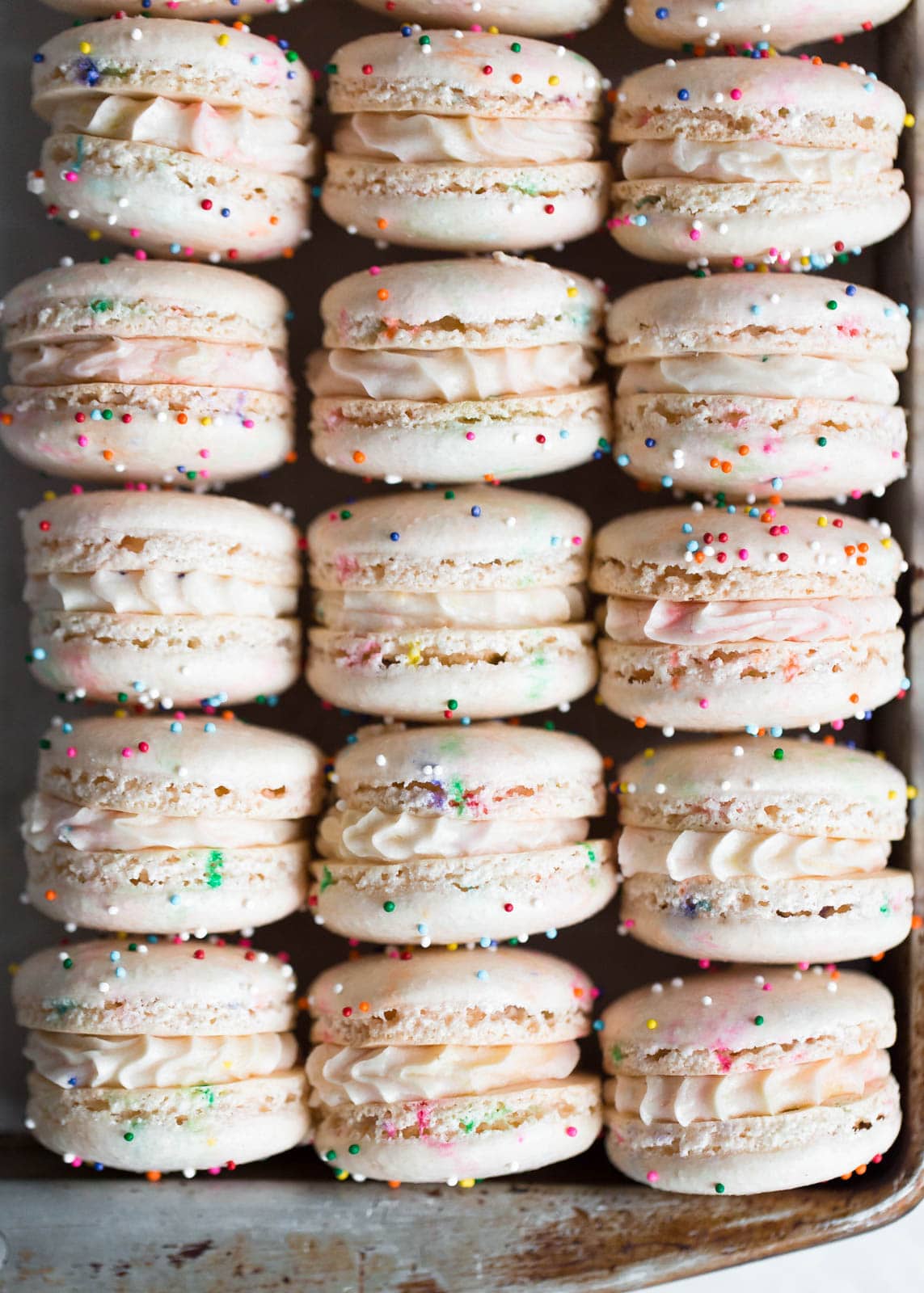 Homemade Cake Batter Macarons that taste like cake batter straight from the bowl. Plus, there's SPRINKLES!