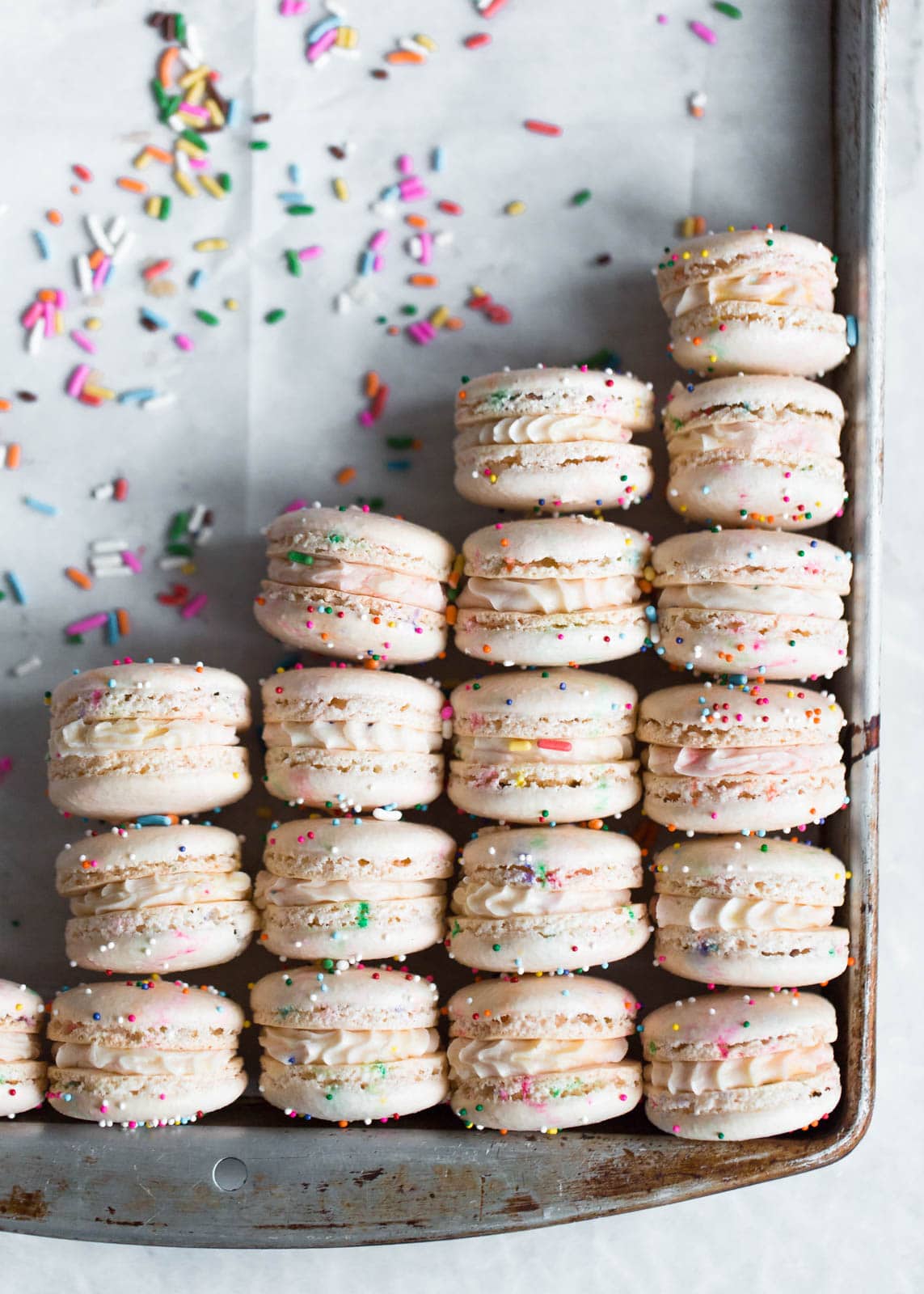 Homemade Cake Batter Macarons that taste like cake batter straight from the bowl. Plus, there's SPRINKLES!
