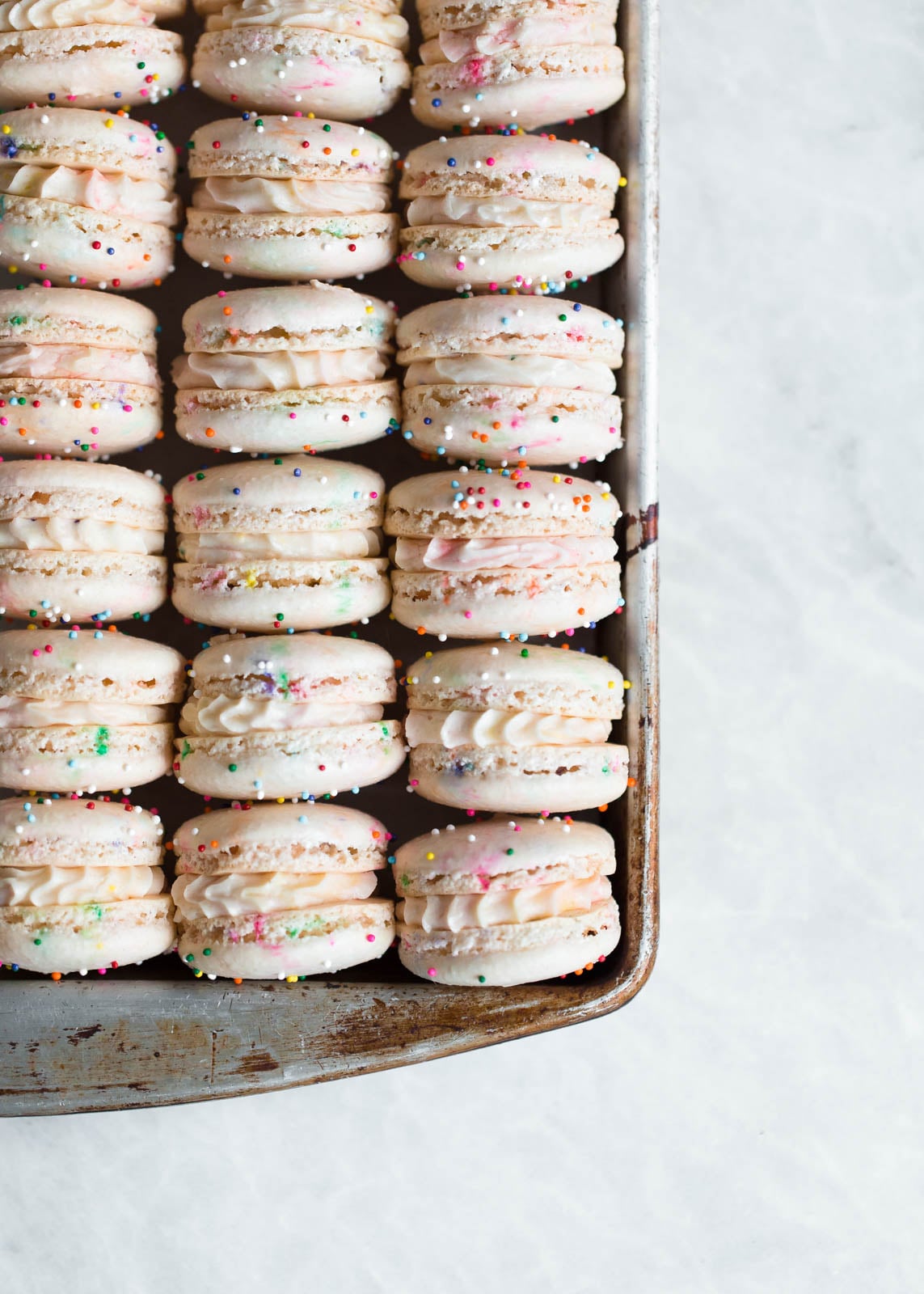 Homemade Cake Batter Macarons that taste like cake batter straight from the bowl. Plus, there's SPRINKLES!